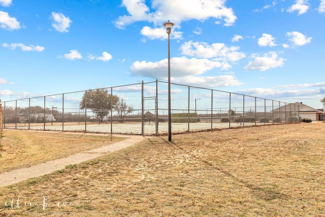 view of property's community with fence and a rural view