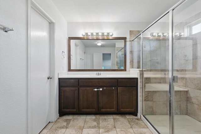 full bathroom with vanity and a stall shower