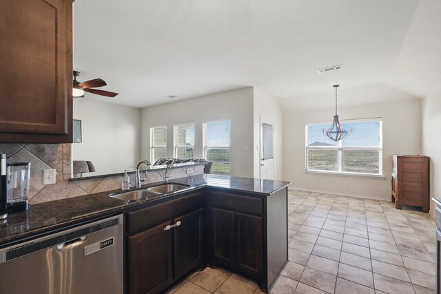 kitchen featuring visible vents, a peninsula, a sink, decorative backsplash, and stainless steel dishwasher