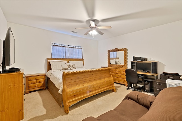 bedroom featuring light carpet, visible vents, and a ceiling fan