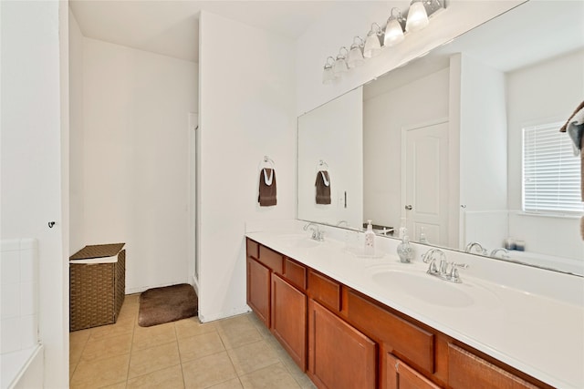 bathroom featuring double vanity, tile patterned flooring, and a sink