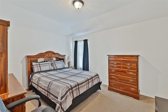 bedroom featuring carpet flooring and baseboards