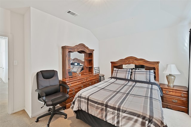 carpeted bedroom with lofted ceiling, baseboards, and visible vents