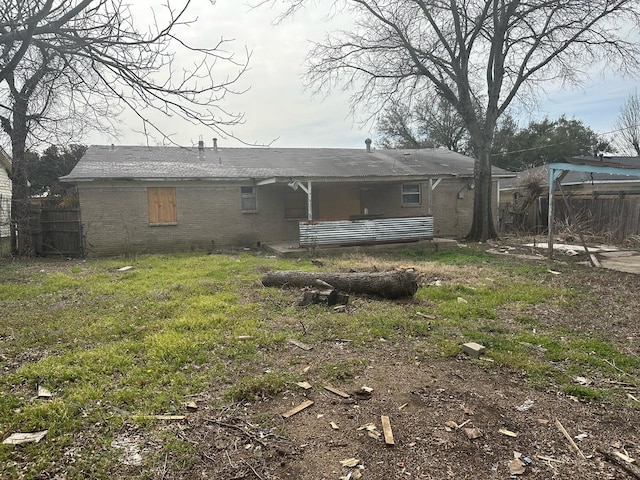 rear view of house with fence