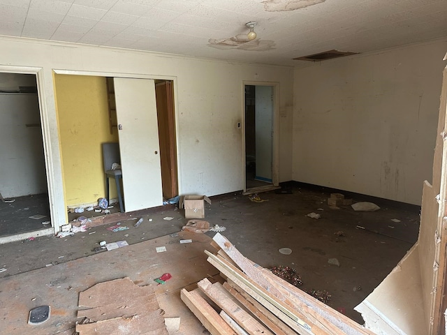 unfurnished bedroom featuring visible vents