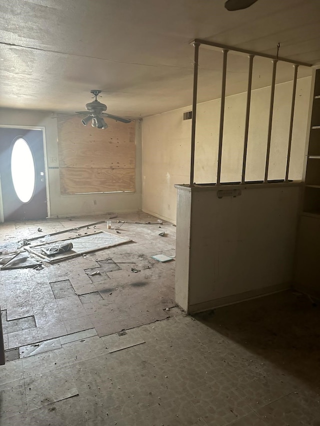 miscellaneous room featuring visible vents and a ceiling fan