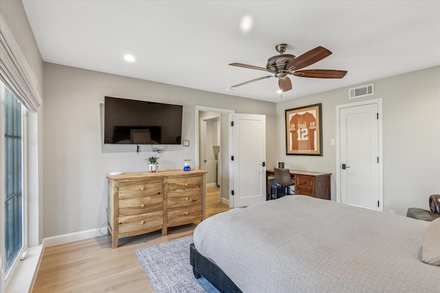 bedroom with recessed lighting, visible vents, light wood-style floors, a ceiling fan, and baseboards