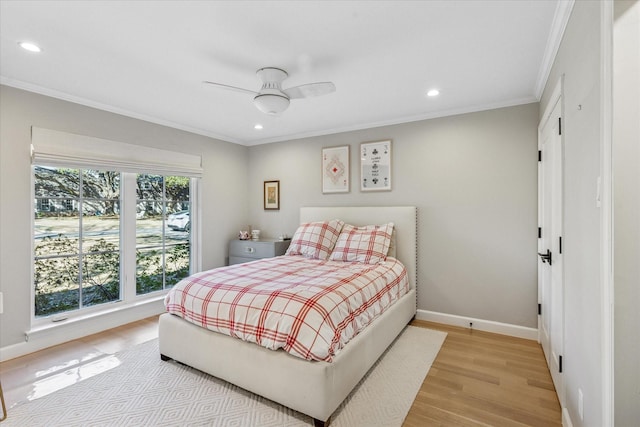 bedroom featuring light wood finished floors, ornamental molding, recessed lighting, and baseboards