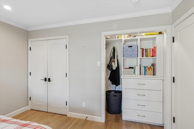 bedroom with light wood-style flooring, baseboards, crown molding, and recessed lighting