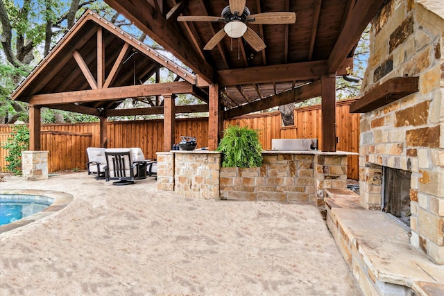 view of patio / terrace featuring a ceiling fan, a fenced backyard, a gazebo, and area for grilling