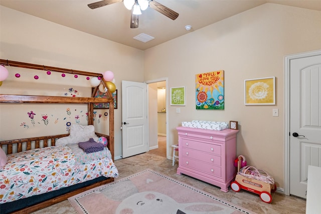 bedroom featuring visible vents, vaulted ceiling, and ceiling fan