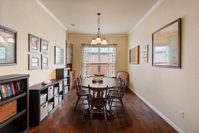 dining space with baseboards, visible vents, ornamental molding, and hardwood / wood-style floors