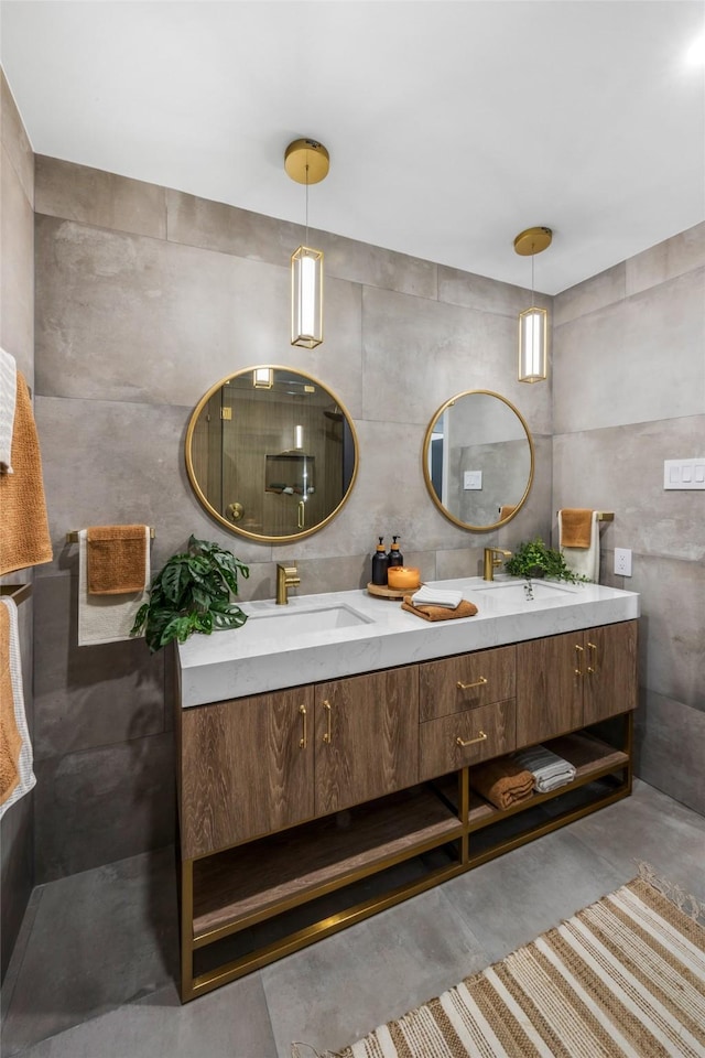 full bath featuring double vanity, concrete floors, and a sink