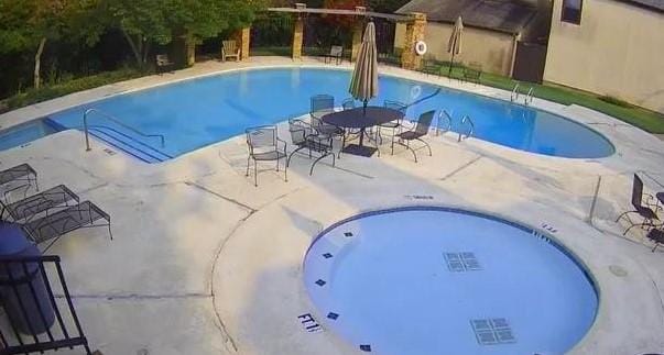 community pool with a patio