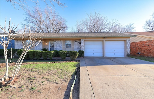 ranch-style house featuring driveway, an attached garage, and brick siding