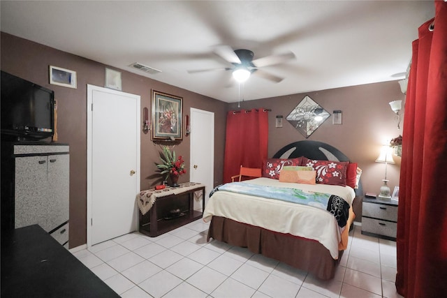 bedroom with a ceiling fan, visible vents, and light tile patterned flooring