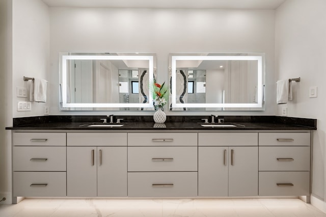 full bath featuring double vanity and a sink