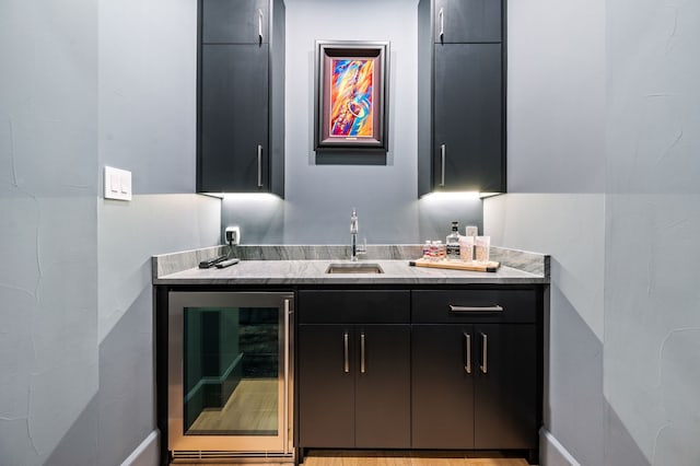 bathroom featuring wine cooler and vanity