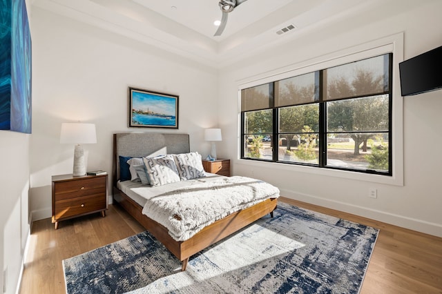 bedroom featuring recessed lighting, wood finished floors, visible vents, and baseboards