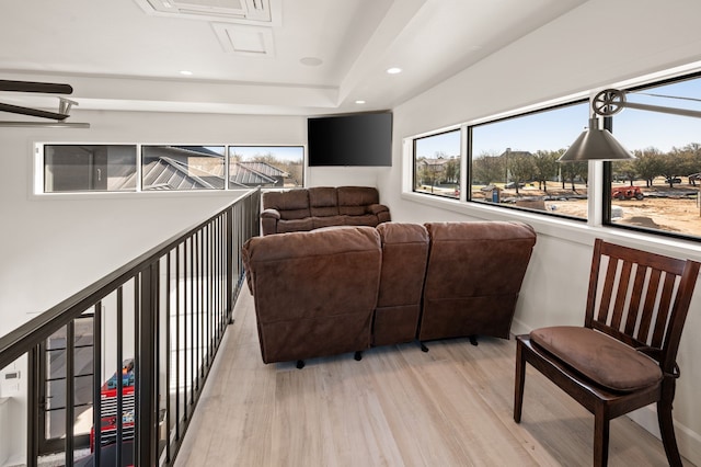 living area with recessed lighting and light wood-style flooring