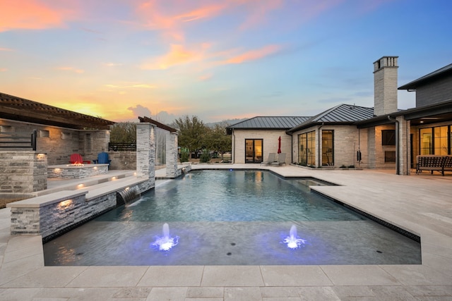 outdoor pool featuring a patio area