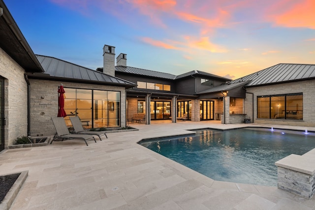 pool featuring a patio area