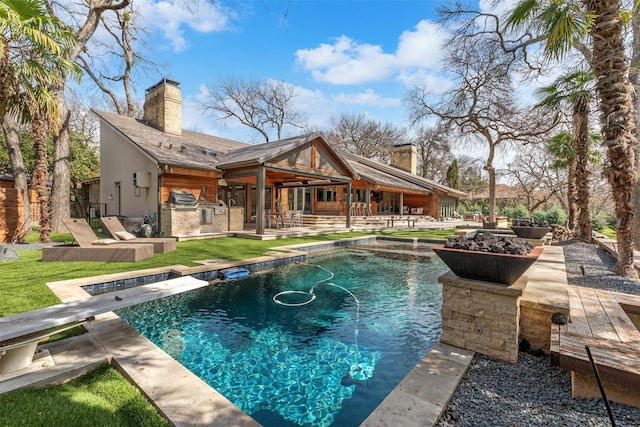 outdoor pool featuring a diving board, a patio area, and area for grilling