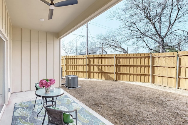 view of patio / terrace with cooling unit, fence, and ceiling fan