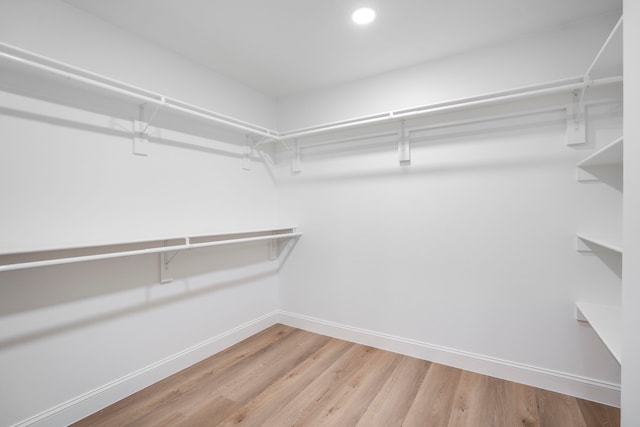 spacious closet with wood finished floors