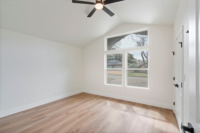 bonus room featuring a ceiling fan, baseboards, vaulted ceiling, and light wood finished floors