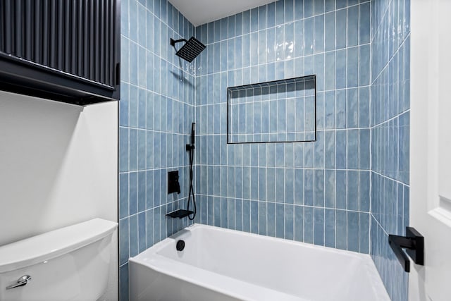 bathroom with shower / washtub combination and toilet