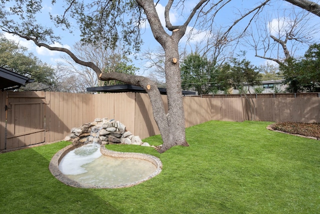 view of yard with a fenced backyard