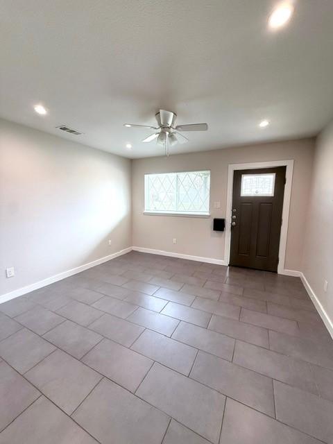 entrance foyer with recessed lighting, a ceiling fan, and baseboards