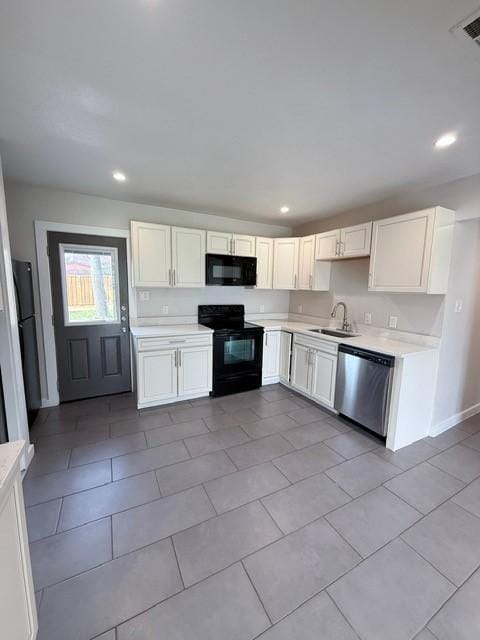 kitchen featuring recessed lighting, light countertops, a sink, and black appliances