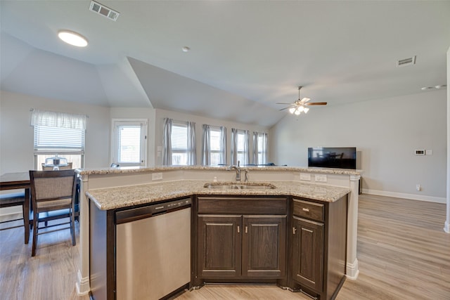 kitchen with dishwasher, open floor plan, a sink, and visible vents