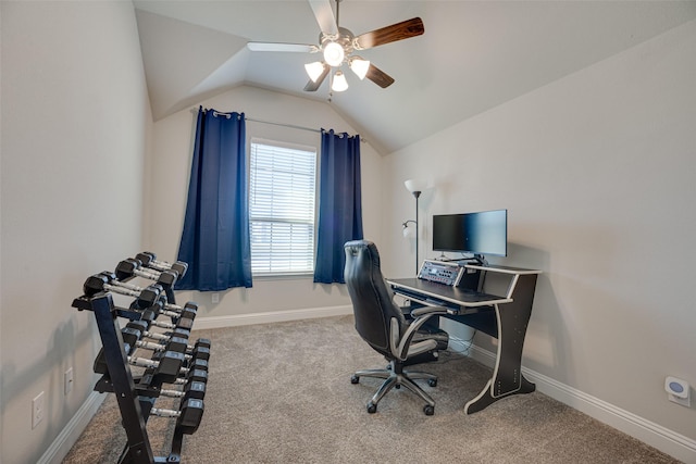 home office with carpet floors, ceiling fan, baseboards, and vaulted ceiling