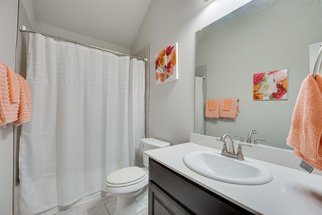 bathroom featuring toilet, lofted ceiling, curtained shower, tile patterned flooring, and vanity