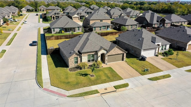 birds eye view of property with a residential view