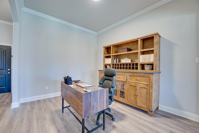 office area featuring ornamental molding, light wood-type flooring, and baseboards