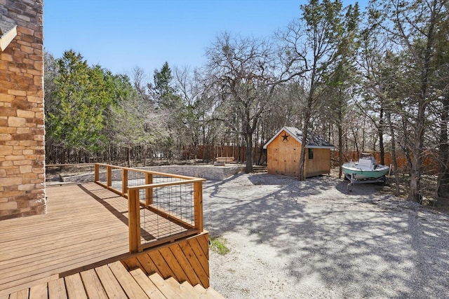 deck with a storage unit and an outdoor structure