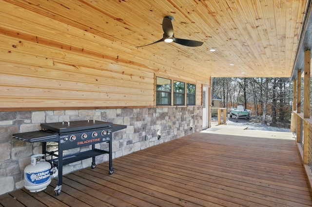 wooden deck featuring ceiling fan