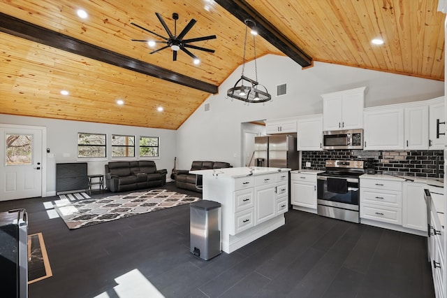kitchen with stainless steel appliances, beamed ceiling, light countertops, wooden ceiling, and dark wood-style floors