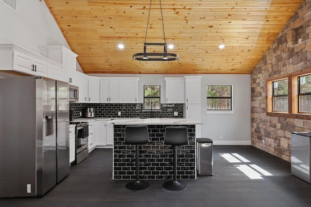 kitchen with wood ceiling, vaulted ceiling, visible vents, and appliances with stainless steel finishes