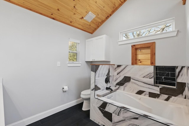 bathroom featuring toilet, a bath, wood ceiling, baseboards, and lofted ceiling