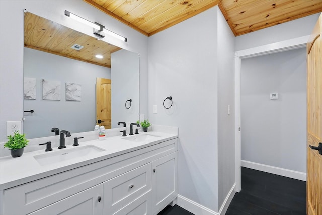 bathroom with wooden ceiling, baseboards, wood finished floors, and a sink