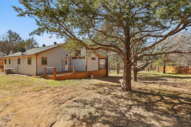 exterior space with central AC unit and a deck