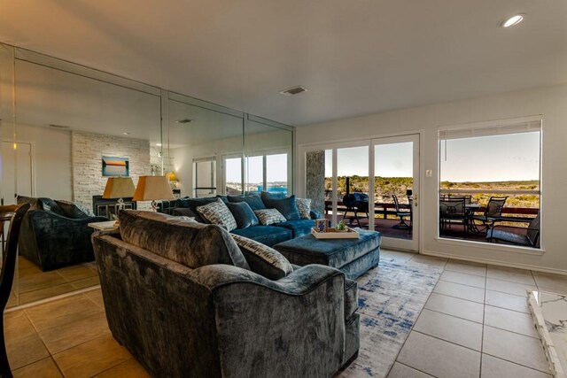 living room with tile patterned flooring, visible vents, and recessed lighting