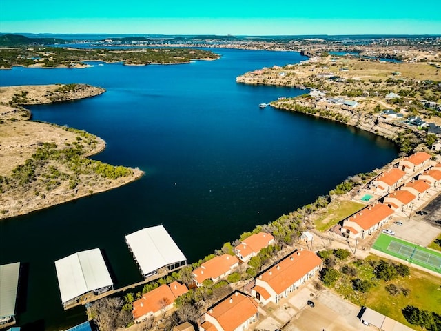 birds eye view of property featuring a water view