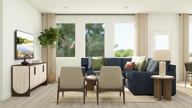 interior space with baseboards and light wood-style floors