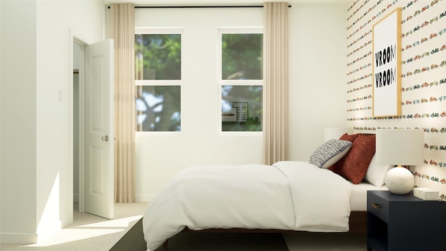 bedroom with carpet floors and baseboards